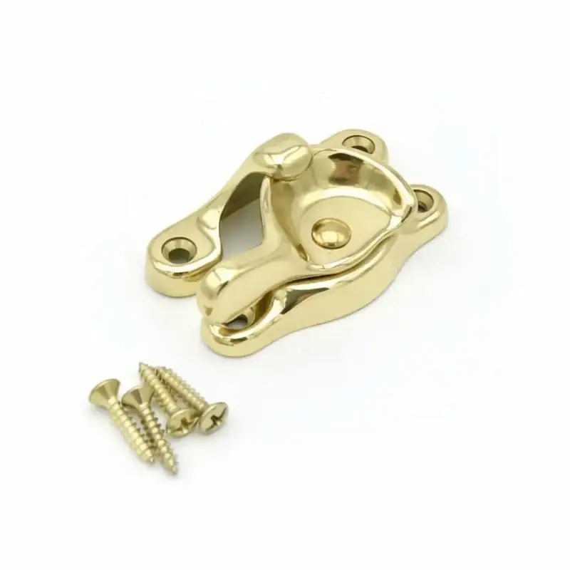 Solid Brass Sash lock - Heritage Supply Polished brass sash lock with curved base, shown with three matching wood screws