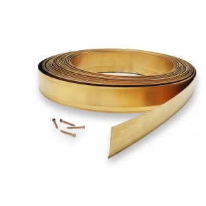 Coiled roll of polished spring bronze weatherstrip with a few brass nails