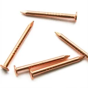 Loose pile of solid bronze nails, 3/4 inch long with flat heads