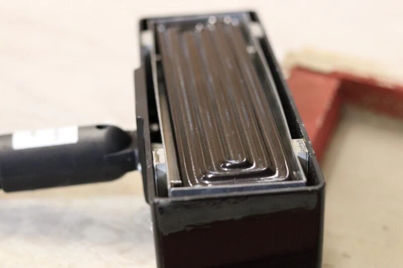 Close-up of the IR Paint Stripper's ribbed infrared heating element in its black housing